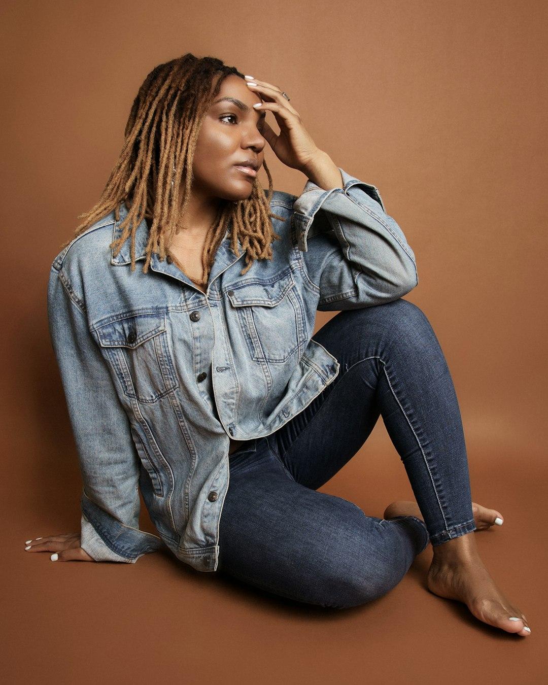 Woman Posing in front of Brown Background