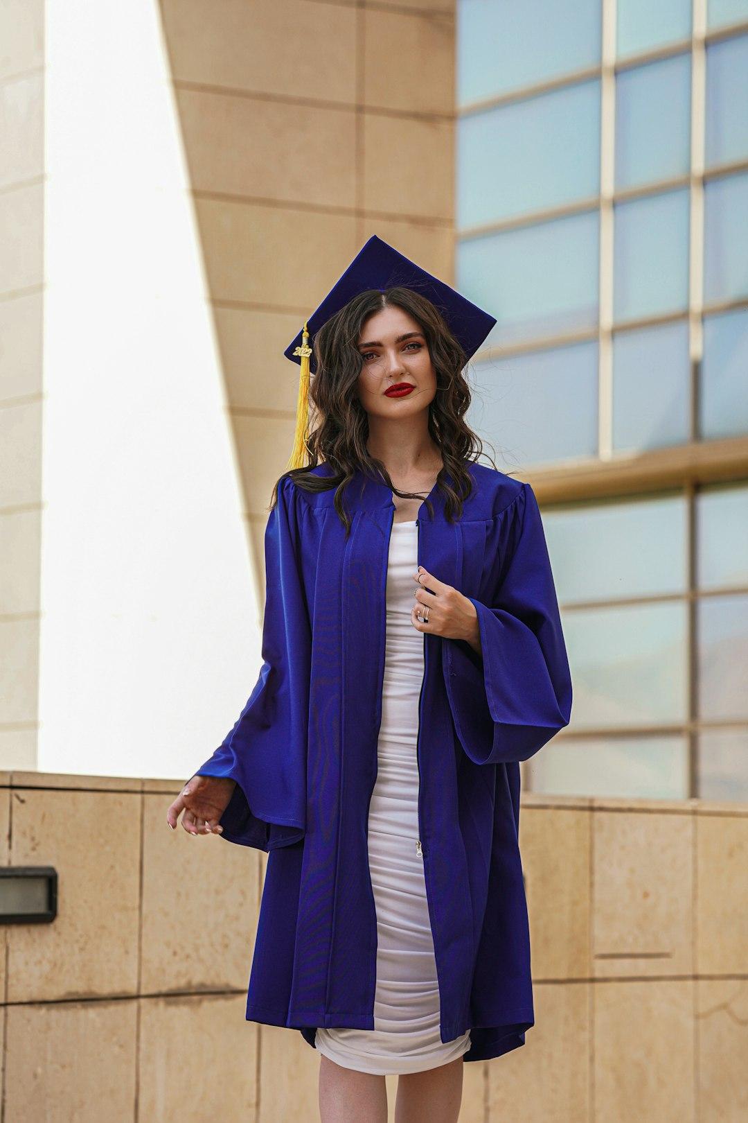 a woman in a graduation gown and cap